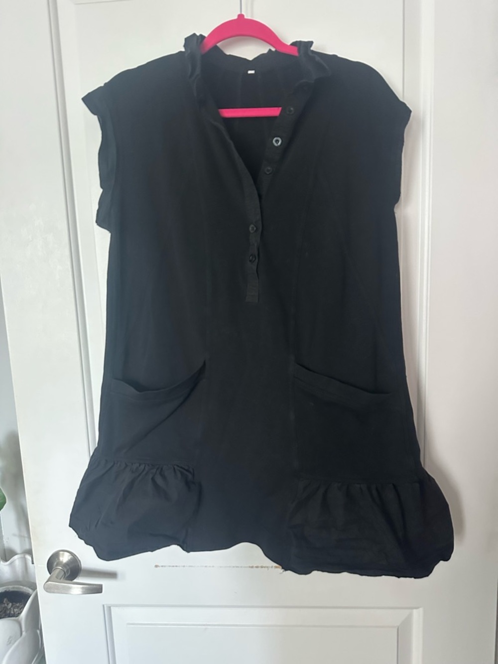 Black Ruffle-Hem Sleeveless Tunic with Front Pockets